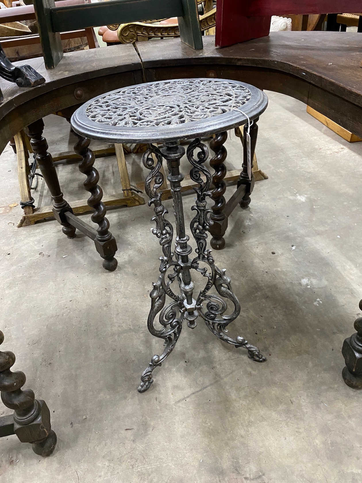 A Victorian style cast iron circular table, diameter 36cm, height 72cm